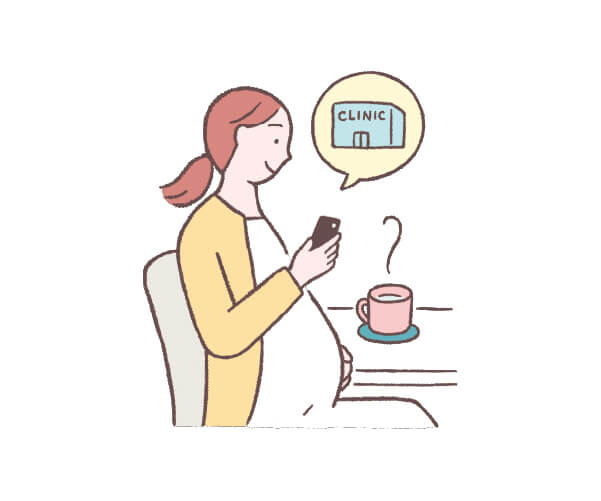 病院をスマホで調べる妊婦