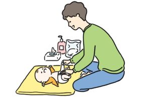 オムツを取り替えるパパ